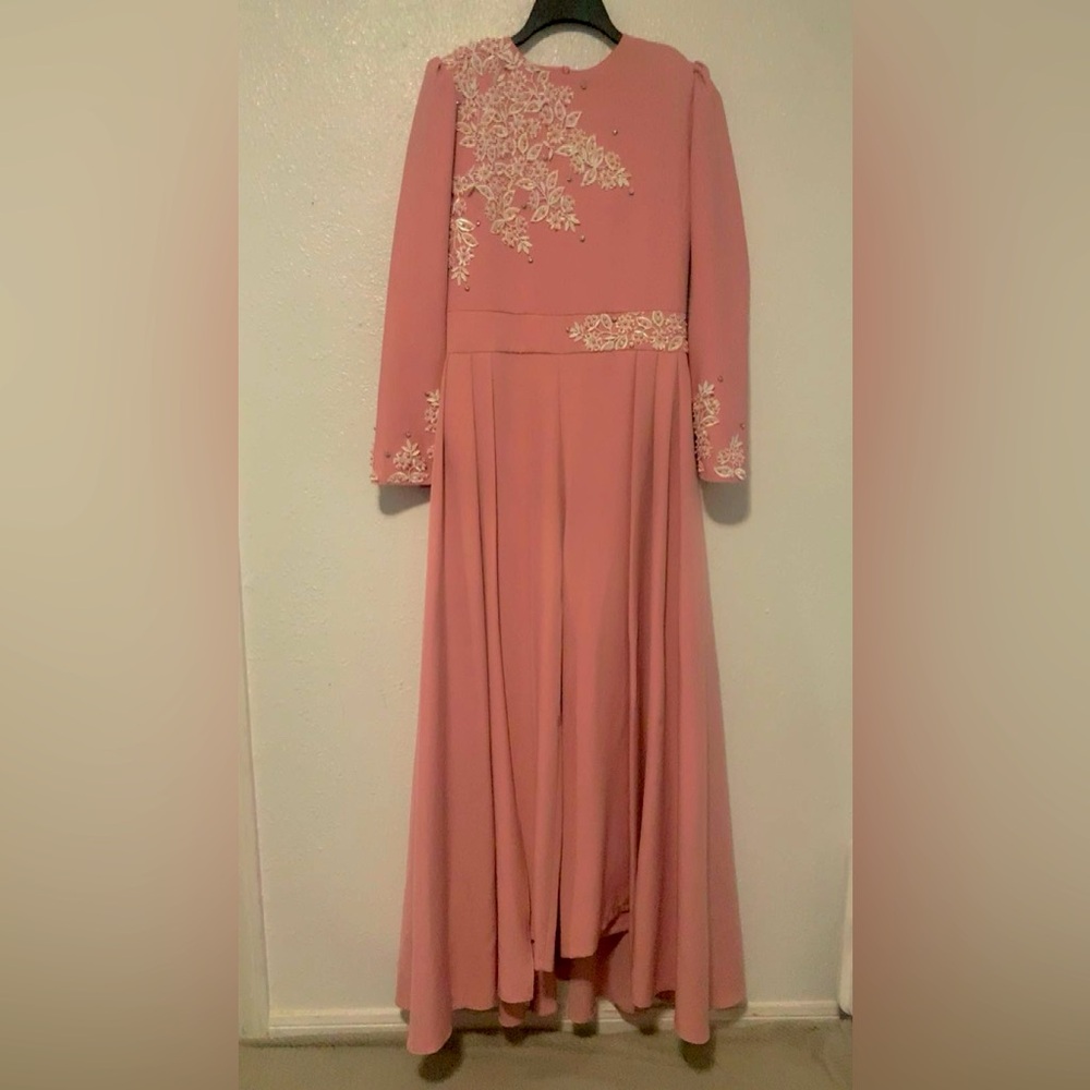 Pink jumpsuit with skirt in the back